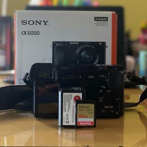 sony a6000 w/ 16-50mm kit lens w/ 64gb sd card and lens cap